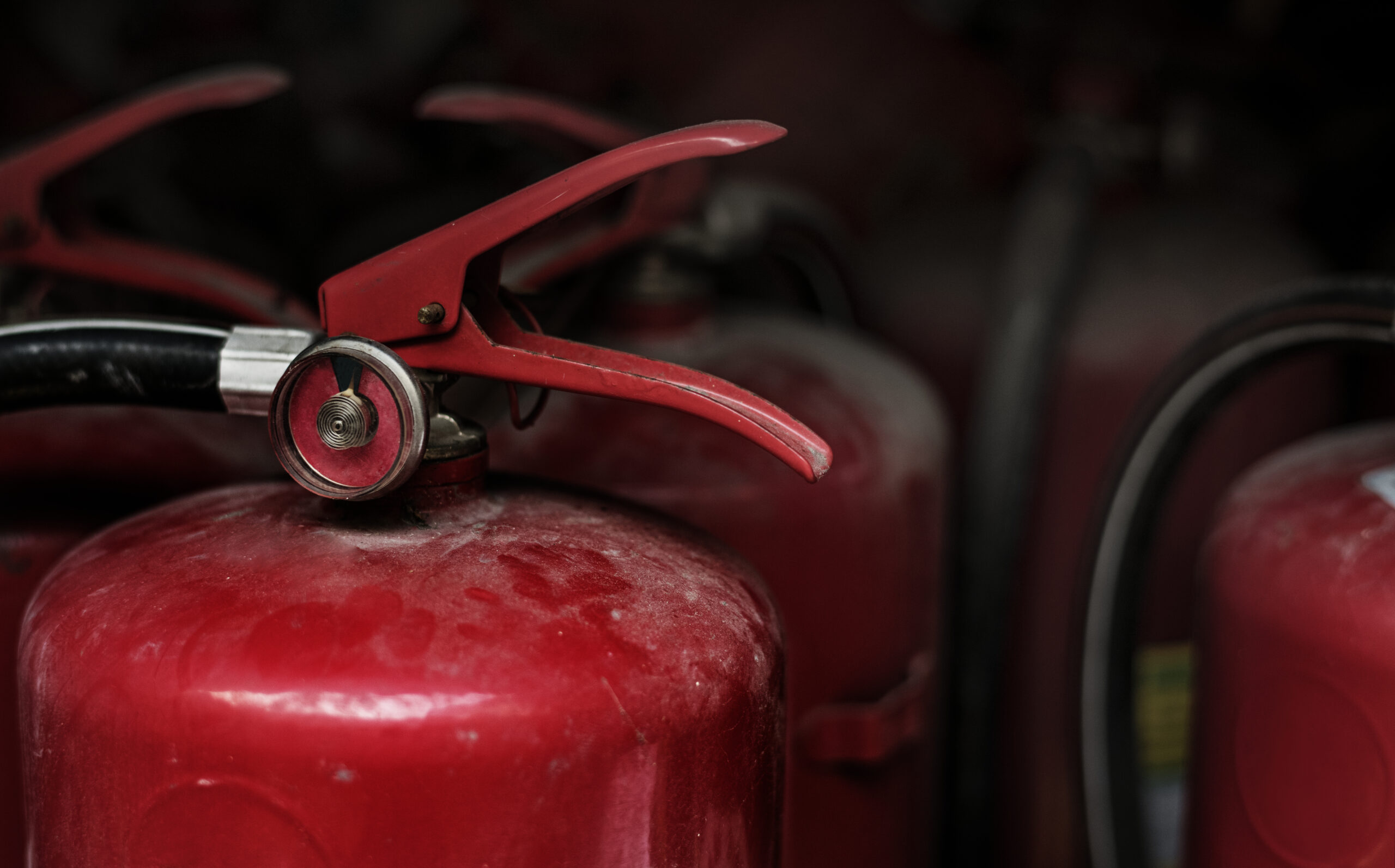 Closeup Of Red Fire Extinguishers