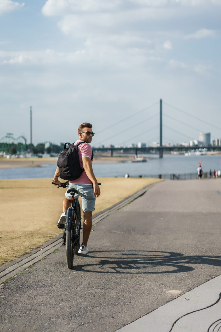 Young Sports Man On A Bicycle In A European City. Sports In Urba